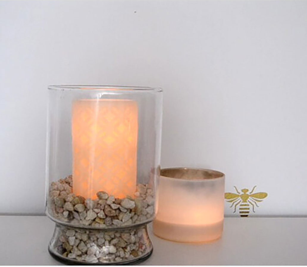 vase with rocks and candle inside